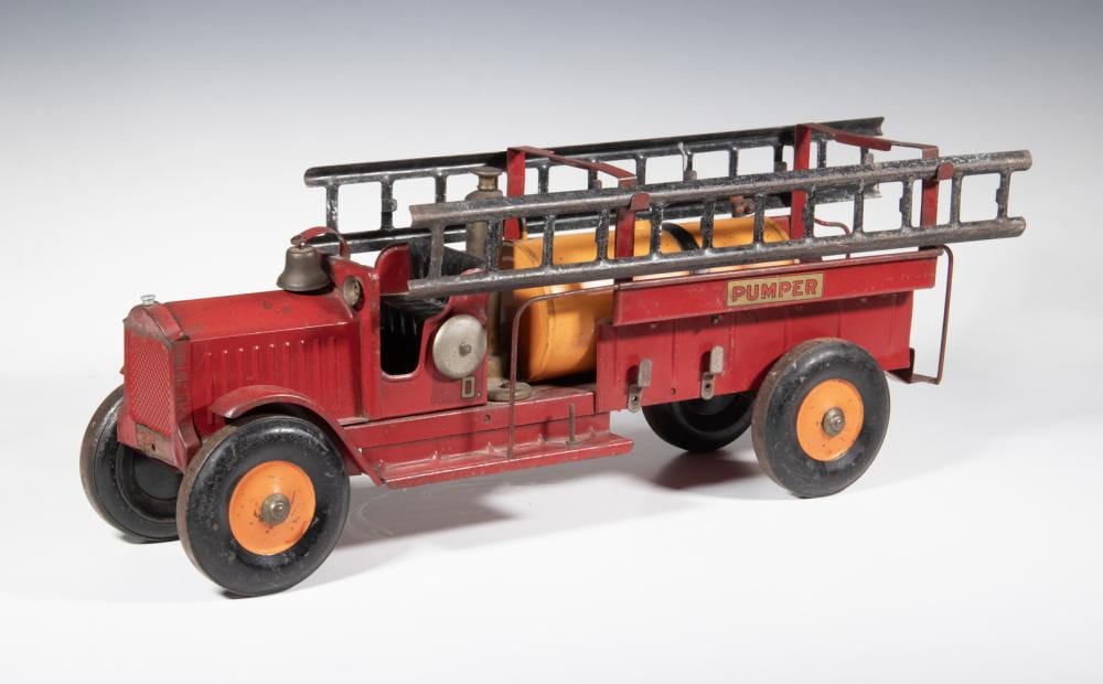 Red and gray toy fire truck with a ladder rig and orange wheels, with the word “PUMPER” on the side.