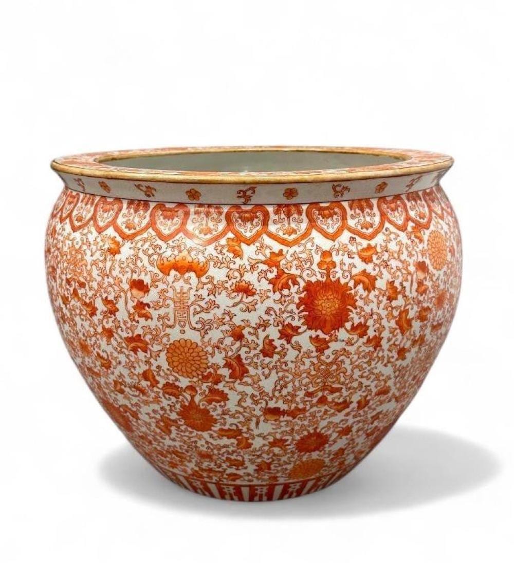 Large Chinese fishbowl-style ceramic planter with orange floral and scroll patterns and a pale rim.