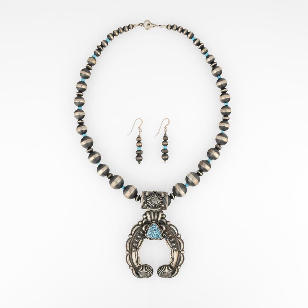 Delbert Gordon comparable auction result: delbert gordon silver and turquoise beaded jewelry set with naja necklace earrings