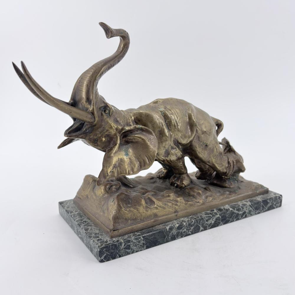 Sylvain Norga comparable auction result: sylvain norga 1892 1968 l l phant encha n une racine sculpture en bronze signature pratiquement illisible ht 23 cm dimensions 26 x 11 5 cm