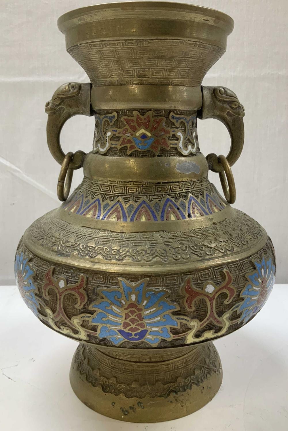 Antique-style brass vase with molded handles and blue red cloisonne floral and geometric decoration on a Greek key band