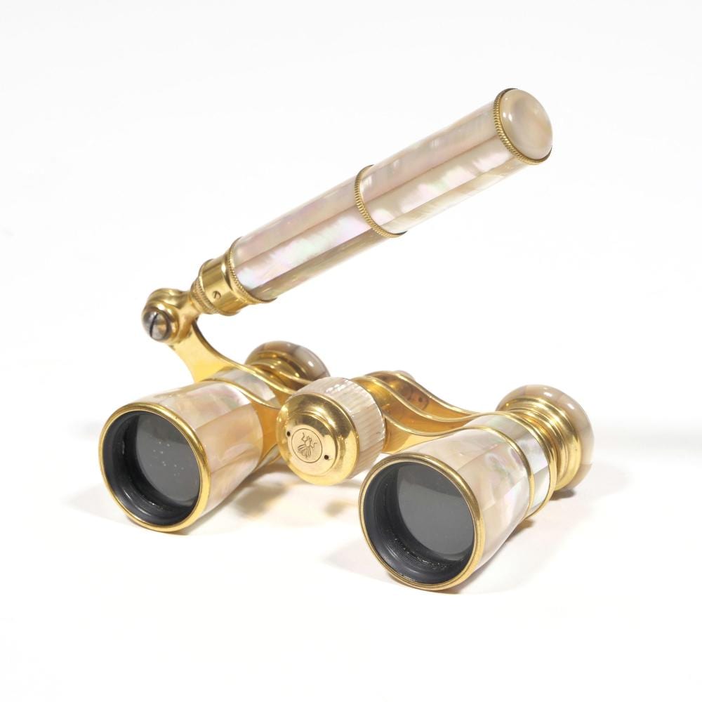Two gold-tone opera glasses with mother-of-pearl style pink iridescent tubes, shown on a white background, with lens ends facing down.