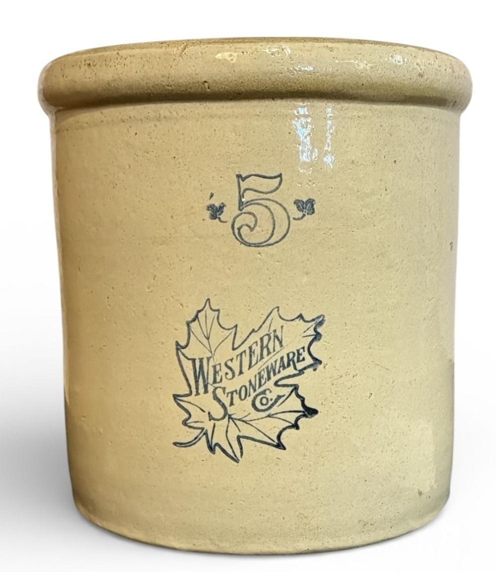 Light tan stoneware crock with a blue number five decal and a blue maple leaf logo reading “Western Stoneware,” shown against a white background.