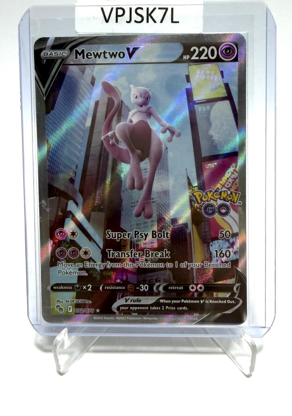 Pokemon trading card featuring Mewtwo V with purple holographic artwork in a clear plastic display case.