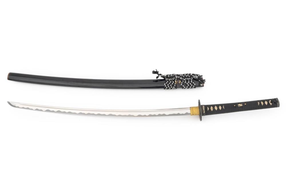 Two long Japanese-style swords laid horizontally on a white background, showing dark scabbards and decorative guards near the handles.