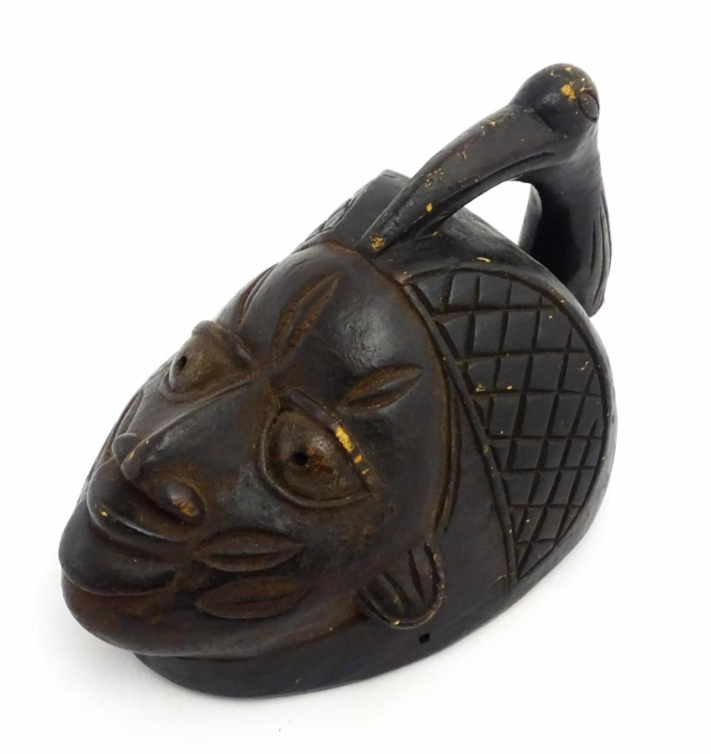 Tadeusz Ajdukiewicz comparable auction result: ethnographic native tribal an african carved wooden mask with facial features surmounted by th