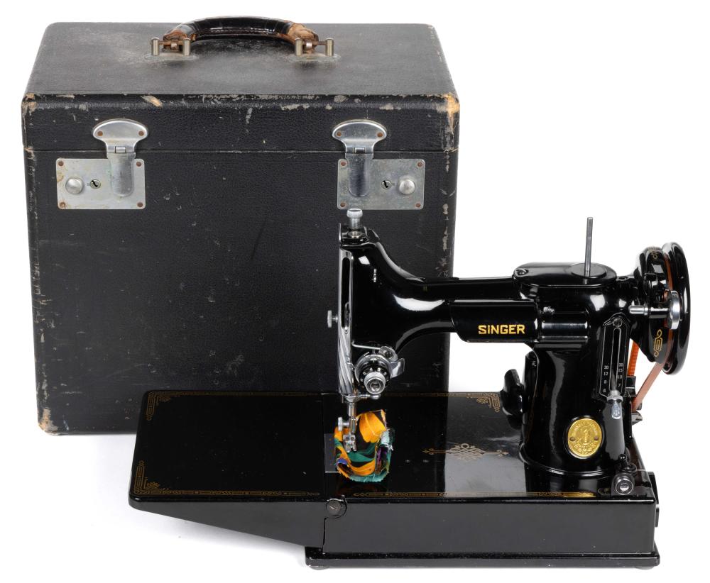 Auction comp thumbnail for SINGER MODEL NO. 221-1 / FEATHERWEIGHT PORTABLE TABLE-TOP ELECTRIC SEWING MACHINE (Jeffrey S. Evans & Associates, Lot 1436)
