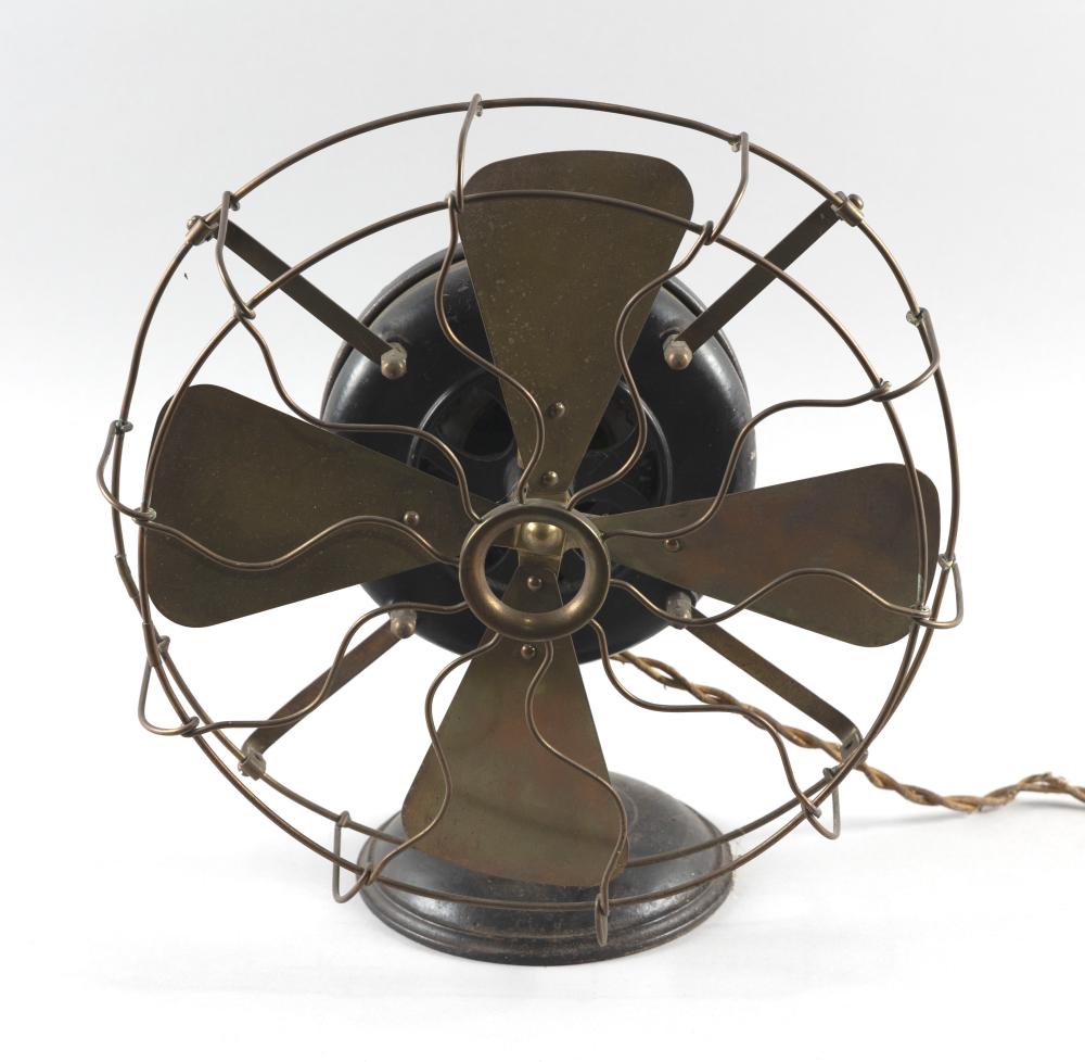 GENERAL ELECTRIC CO. "PANCAKE" ALTERNATING-CURRENT MOTOR FAN Late 19th Century Height 14". Cage diameter 13". sold by Eldred's, lot 9230 — auction record photograph