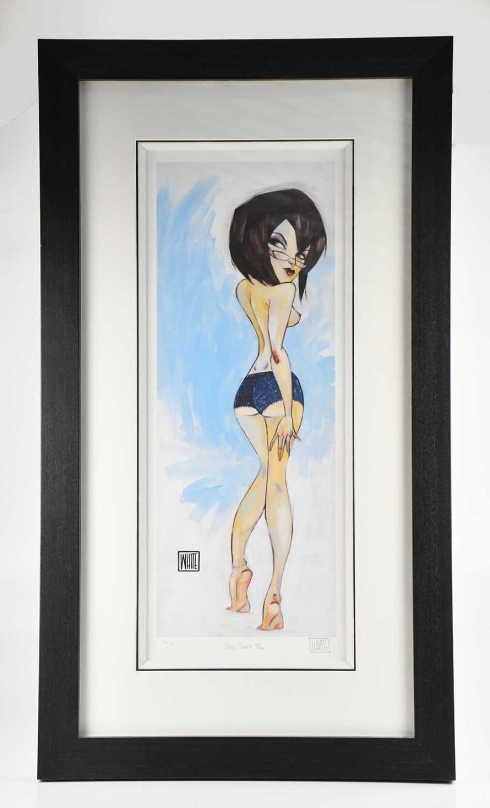 Framed limited edition print showing a stylized nude woman with black bobbed hair standing in a blue sky background, signed at the bottom.