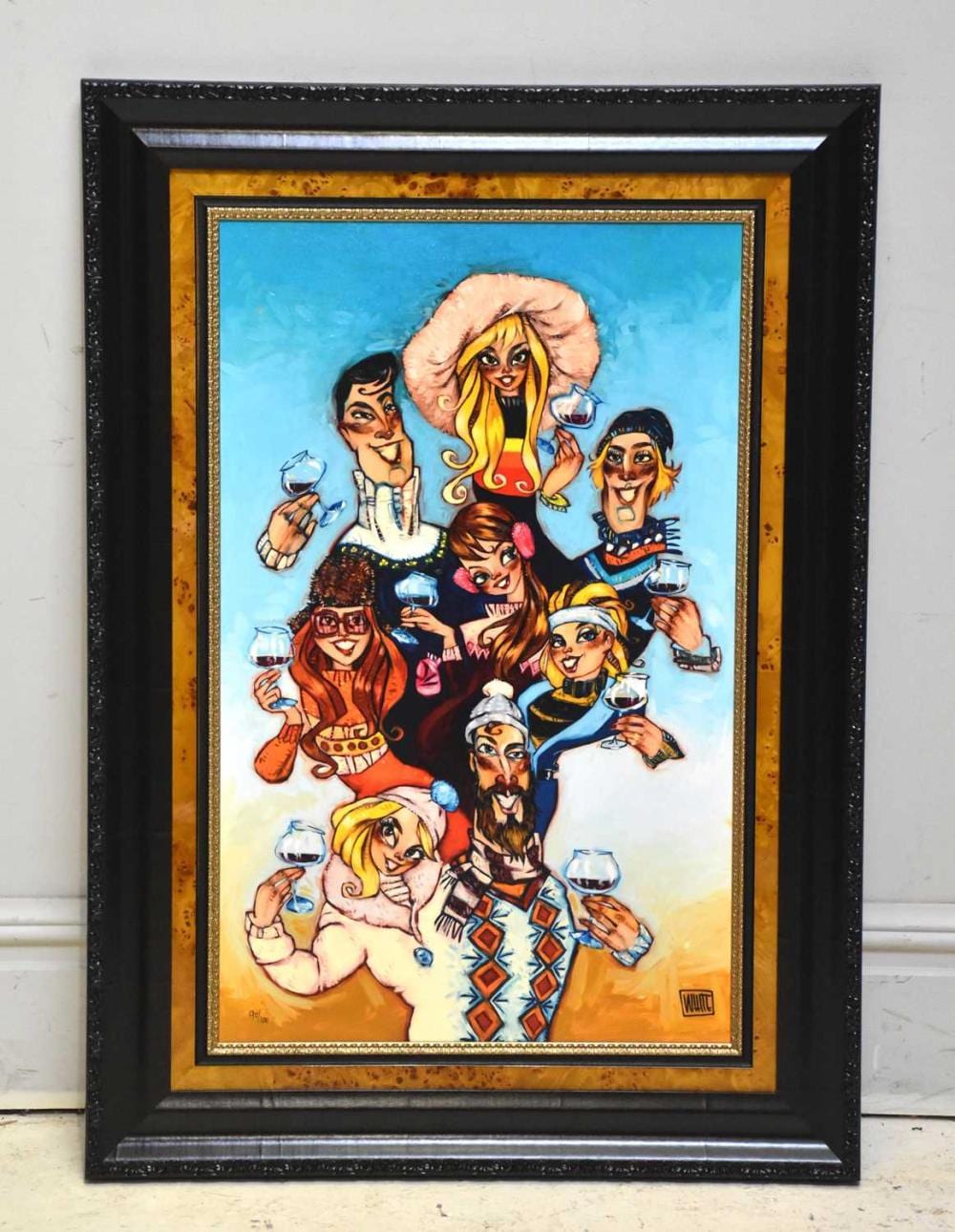 Framed colorful limited-edition print showing a group of seven people in winter-style outfits holding wine glasses against a blue sky background.