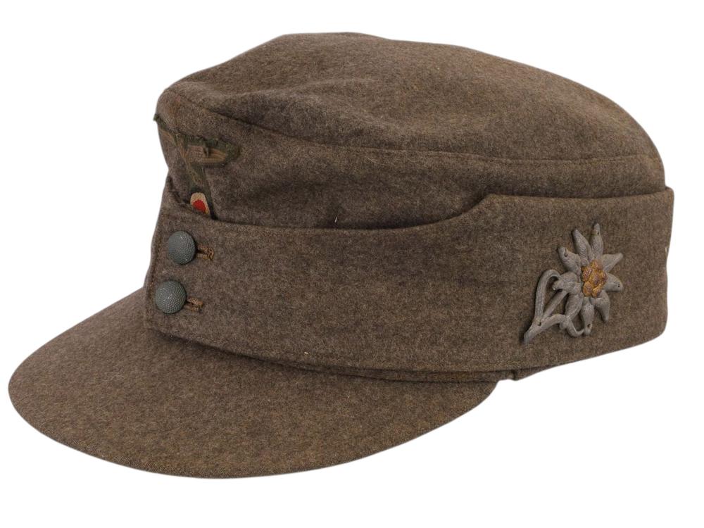 A GERMAN WWII HEER M43 MOUNTAIN TROOPS FIELD CAP WITH EDELWEISS BADGE, CIRCA 1943–1944 sold by Helios Auctions, lot 31 — auction record photograph