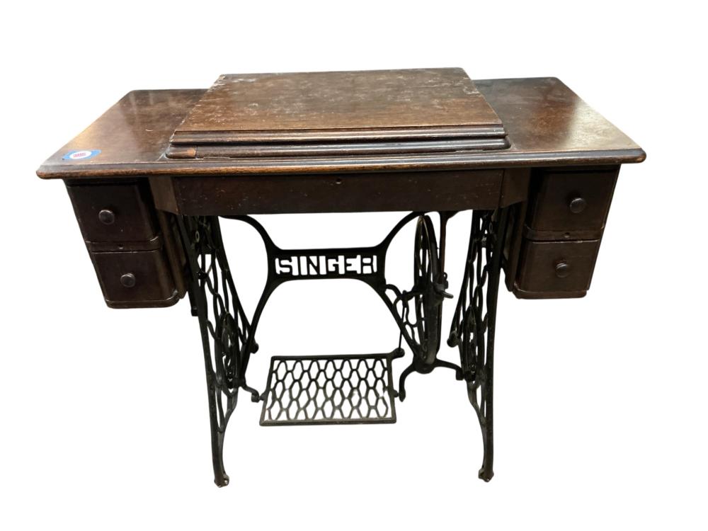 Antique Singer Treadle Sewing Machine & Cabinet sold by Apple Tree Auction Center, lot 4092 — auction record photograph