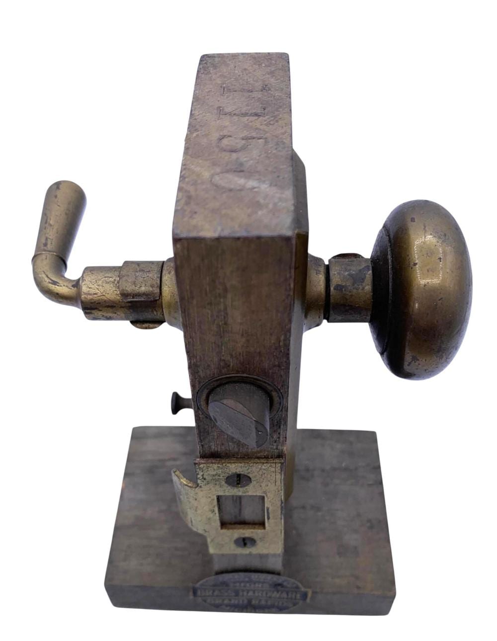 Antique-style door knob lock mechanism with a mounted spindle and two knob-shaped end pieces on a metal base.
