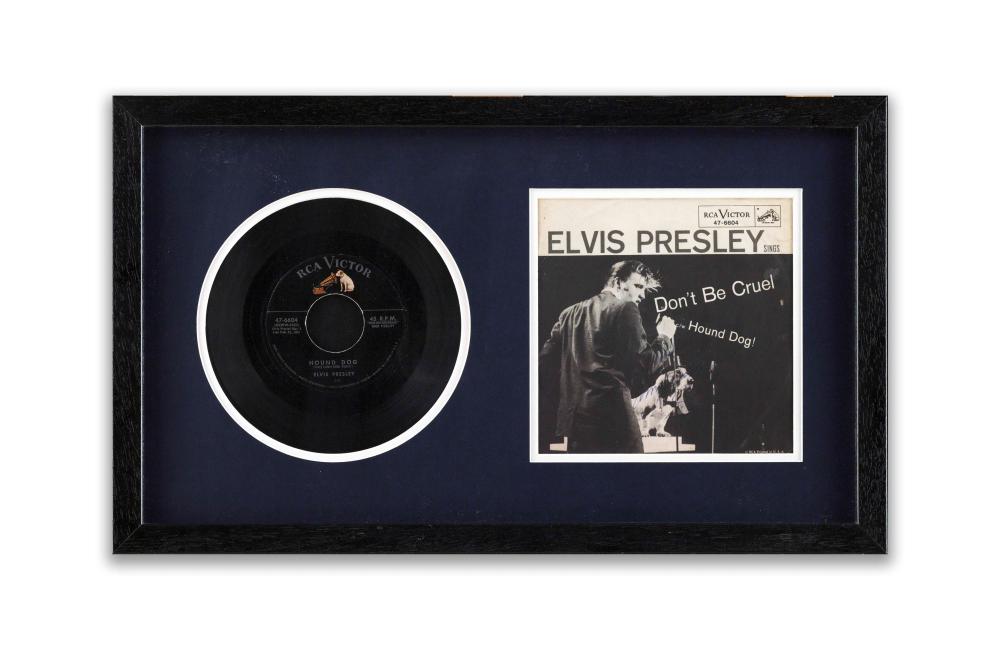 Framed display with a black vinyl record and an Elvis Presley sleeve card labeled “Don’t Be Cruel / Hound Dog.”