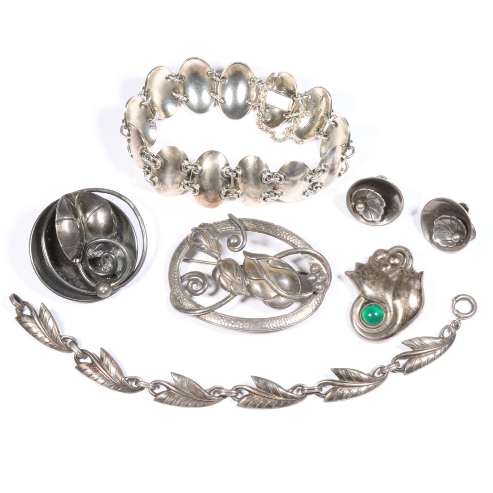 Auction comp thumbnail for Georg Jensen floral earrings, Gertrude Engel thumbnail bracelet, Joseph Masaniello leaf brooch, included in sterling silver Danish modernist jewelry group. 7"L x 3/4"W (oval bracelet) (Ripley Auctions, Lot 98)