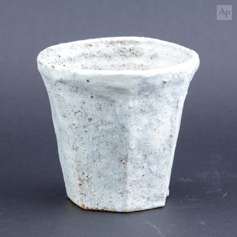 akiko hirai born 1970 a faceted stoneware cup covered in white glaze with iron staining painted mark height 8 5cm · Adam Partridge Auctioneers · 2026-03-27 Akiko Hirai comparable auction result: akiko hirai born 1970 a faceted stoneware cup covered in white glaze with iron staining painted mark height 8 5cm
