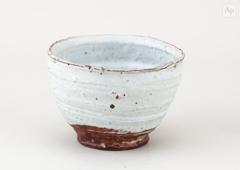 akiko hirai born 1970 a stoneware cup covered in white glaze with iron staining height 7cm · Adam Partridge Auctioneers · 2026-03-27 Akiko Hirai comparable auction result: akiko hirai born 1970 a stoneware cup covered in white glaze with iron staining height 7cm
