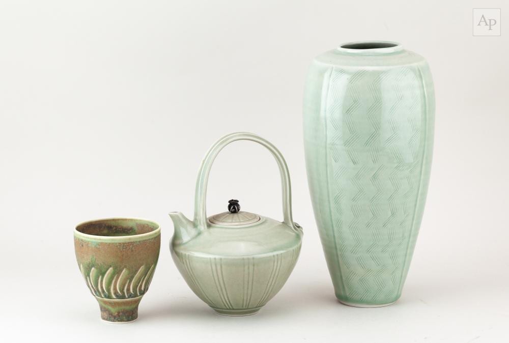 Bridget Drakeford comparable auction result: bridget drakeford born 1946 a tall porcelain vase covered in celadon glaze with incised decoration incised signature height 25 5cm a matching teapot and a cup 3