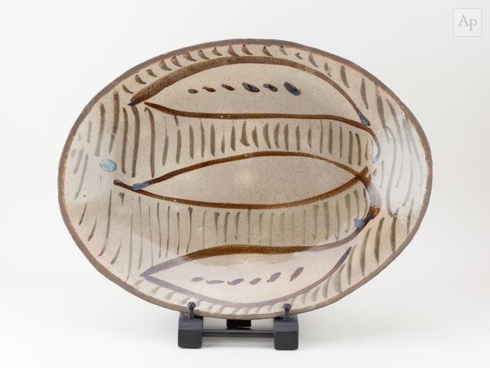Michael Cardew comparable auction result: michael cardew 1901 1983 for wenford bridge pottery a large oval press moulded stoneware platter with vume lily decoration painted mc mark diameter 48 5cm