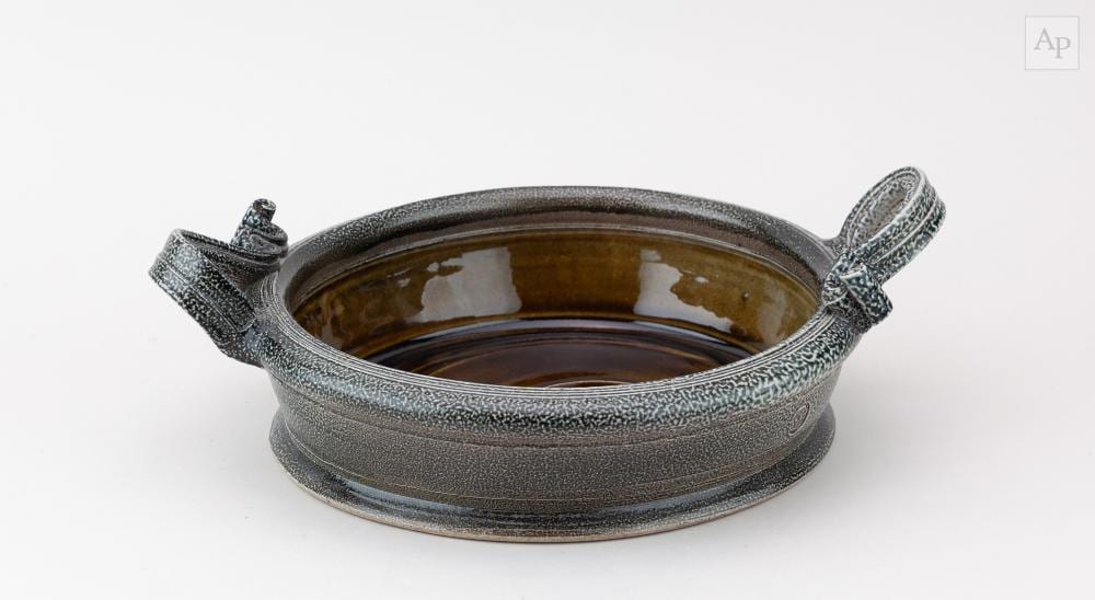 walter keeler born 1942 an oval salt glazed bowl with loop handles impressed marks gallery sticker diameter 31cm including handles · Adam Partridge Auctioneers · 2026-03-27 Walter Keeler comparable auction result: walter keeler born 1942 an oval salt glazed bowl with loop handles impressed marks gallery sticker diameter 31cm including handles