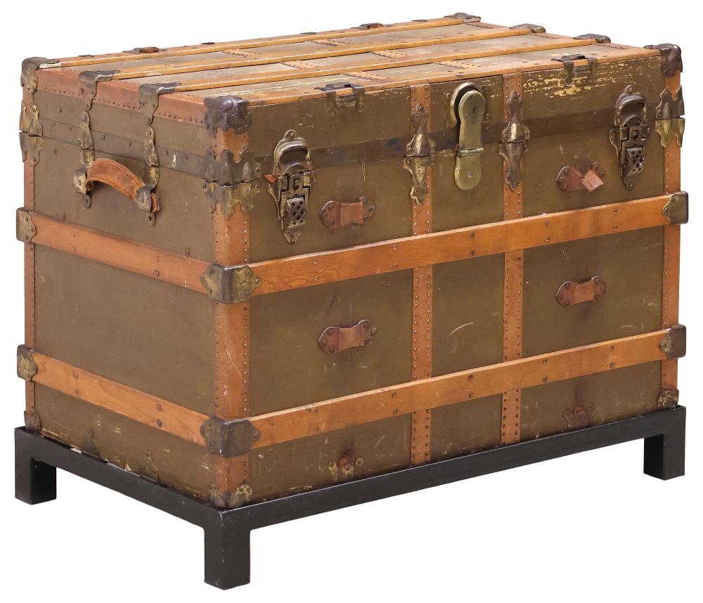LARGE CANVAS-CLAD STEAMER TRUNK / TRAVEL CHEST ON METAL BASE sold by Austin Auction Gallery, lot 1306 — auction record photograph