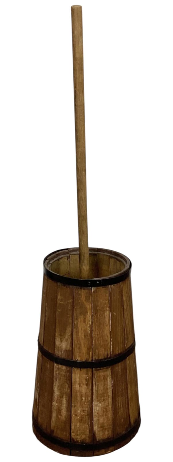 Antique-style wooden churn bucket with vertical plunger, round barrel shape, and dark metal bands, photographed against a white background.