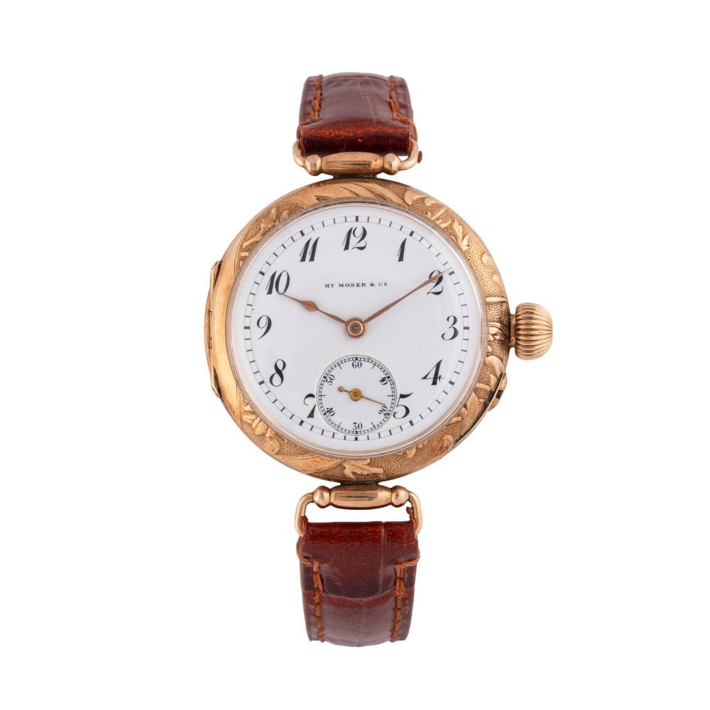 H. Moser comparable auction result: h moser cie 14 kt rose gold manual wind time only watch with articulated lugs and porcelain dial with black breguet numerals