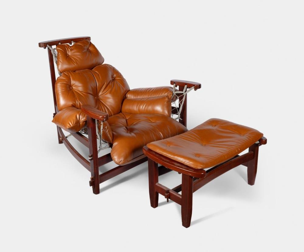 Jean Gillon comparable auction result: jean gillon romania 1919 brazil 2007 lounge chair jangada with ottoman 1960s mahogany wood and stained leather exhibits wear consistent with age and use