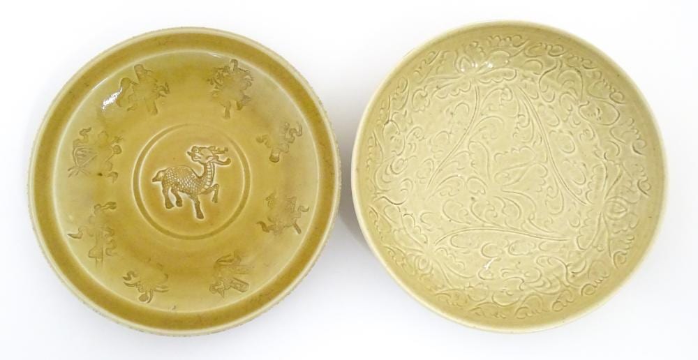 Auguste-François Gay comparable auction result: a chinese ochre glazed dish with a central qilin deer dragon bordered by au