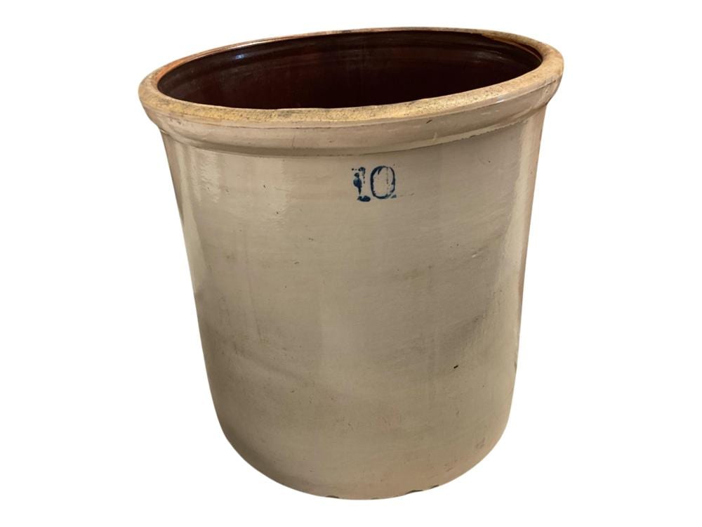 Cream-colored ceramic crock with dark interior glaze and a blue “10” marking near the rim.
