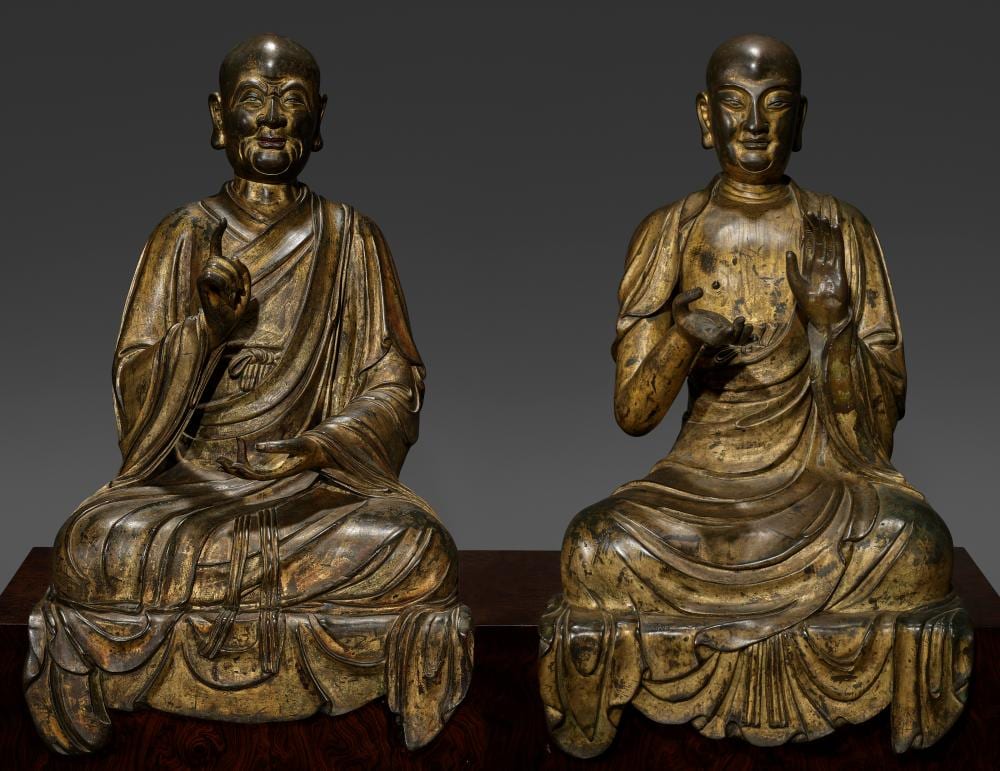 An Exceedingly Rare Pair Of Gilt-Bronze Luohan Figures. Early Ming Dynasty, comparable sale