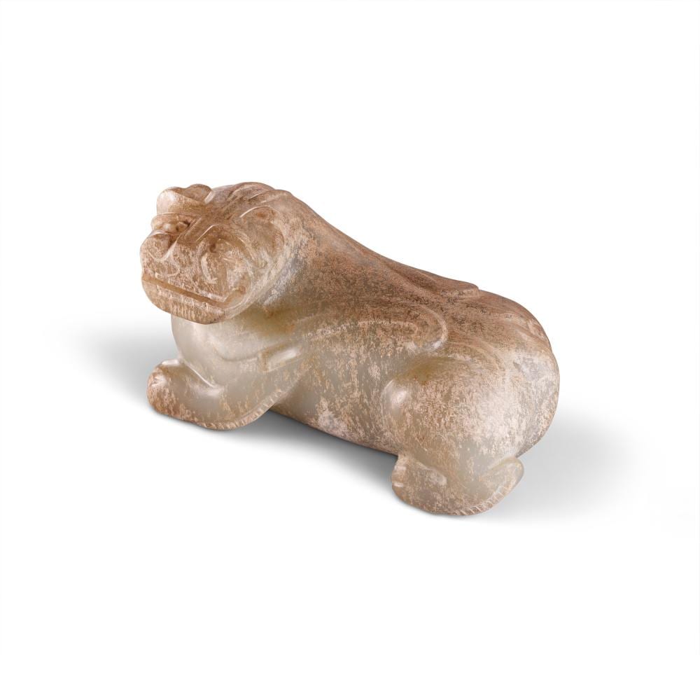 An Exceptionally Rare Archaic Jade Carving OF A TIGER. LATE EASTERN HAN DYN comparable sale