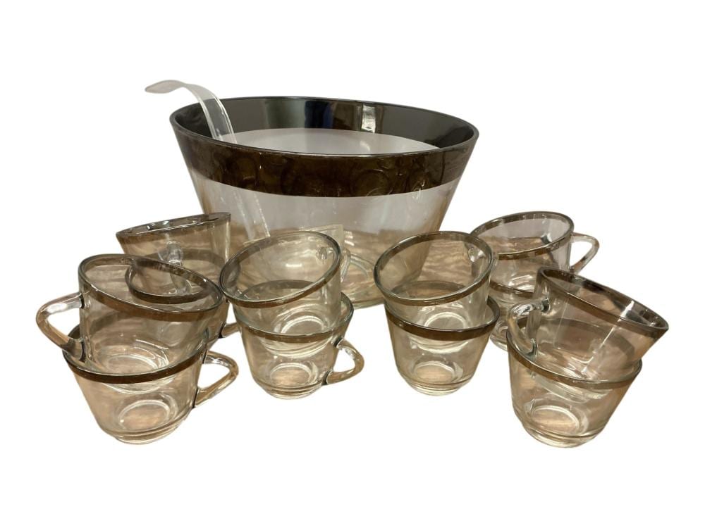 Smoked glass punch bowl set with one large bowl, six small handled cups, and a ladle, arranged on a white background.