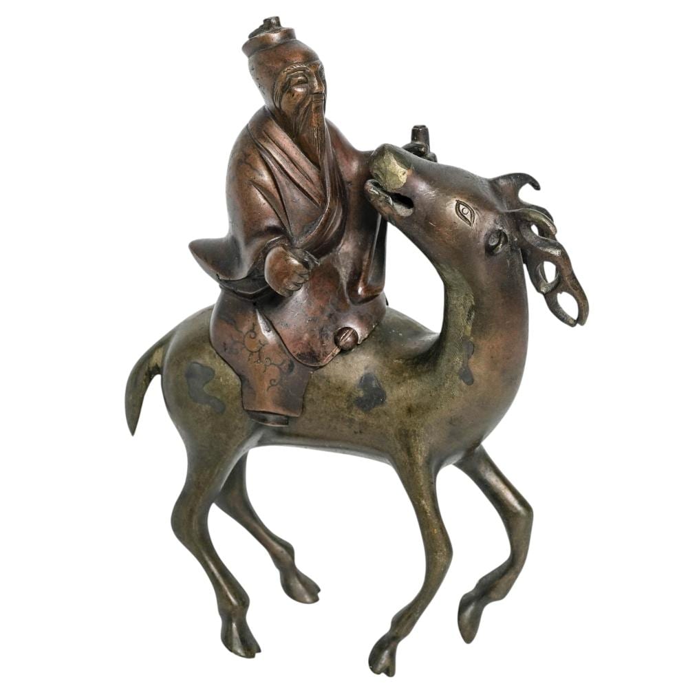 Antique-style bronze incense burner shaped like a seated elderly figure on a sculpted dragon or horse, with green patina accents.