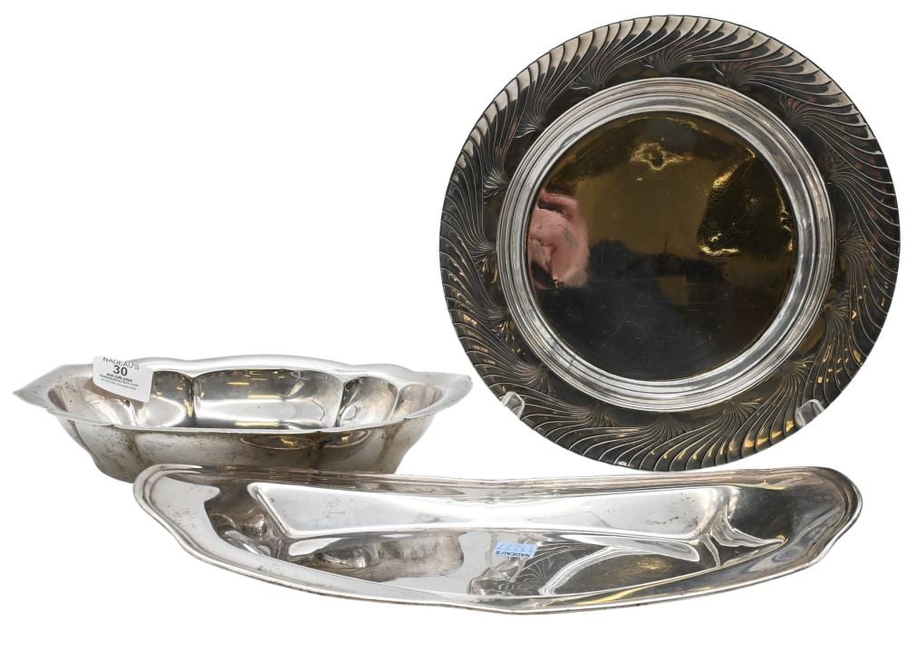 Three-piece silver-toned serving set with rectangular tray and shallow bowl, plus a separate round decorative tray in the background.