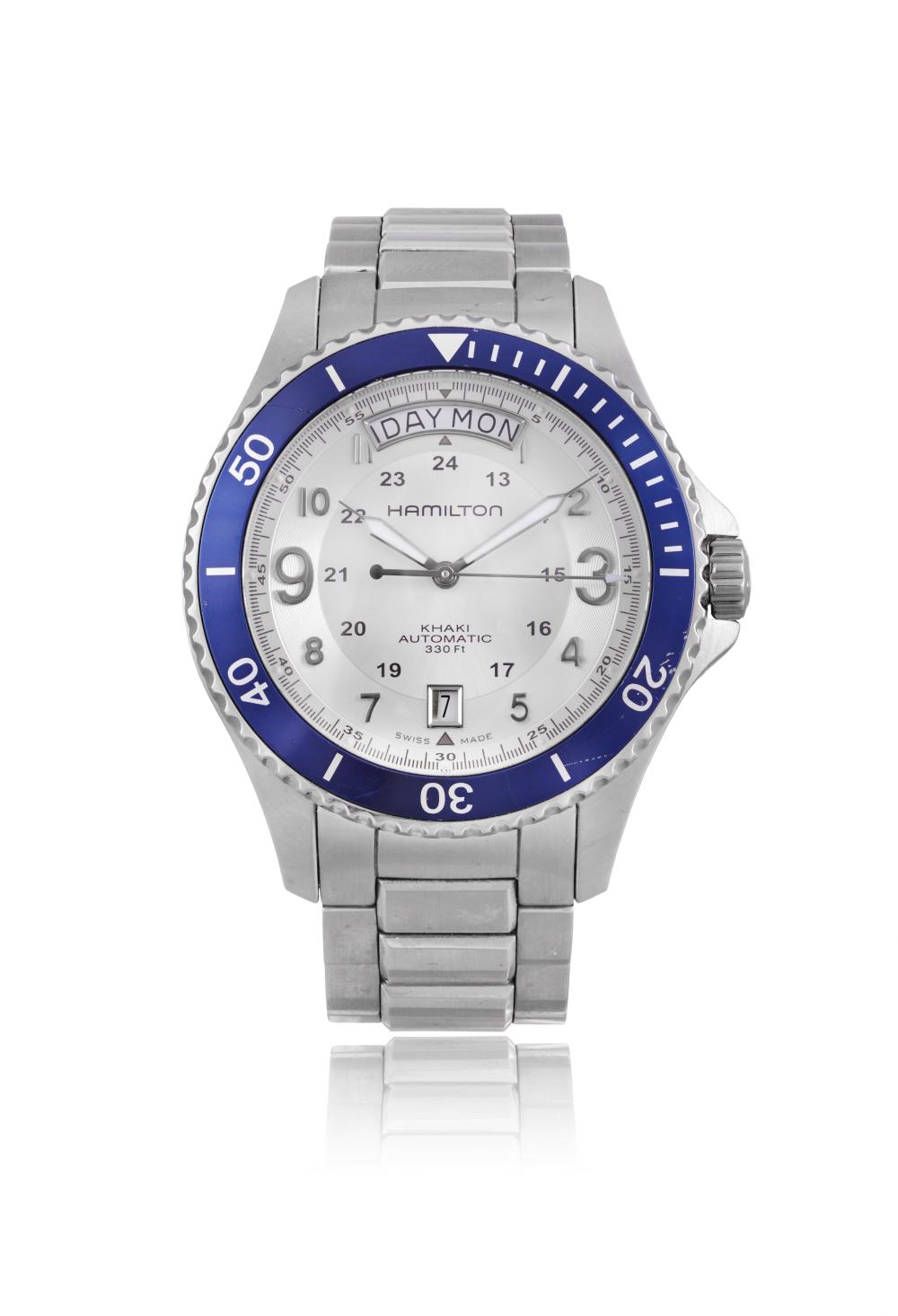 HAMILTON KHAKI NAVY DAY-DATE AUTOMATIC WRISTWATCH A stainless steel automatic wristwatch by Hamilton. Circa: 2010s Dial: Silvered dial with applied Arabic numerals, outer minute track, day aperture at 12 o’clock, date aperture at 6 o’clock, inn sold by Adam's, lot 110 — auction record photograph