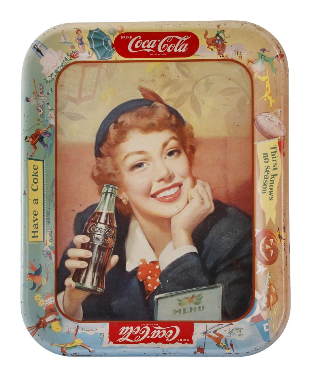Vintage Coca-Cola metal tray with a smiling woman holding a Coca-Cola bottle, colorful circus-like graphics around the border.