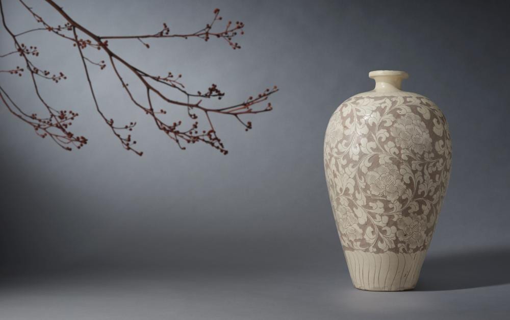 AN EXCEPTIONALLY RARE AND LARGE CIZHOU WHITE-GLAZED SGRAFFIATO 'PEONY' VASE, MEIPING Northern Song Dynasty (2) comparable sale