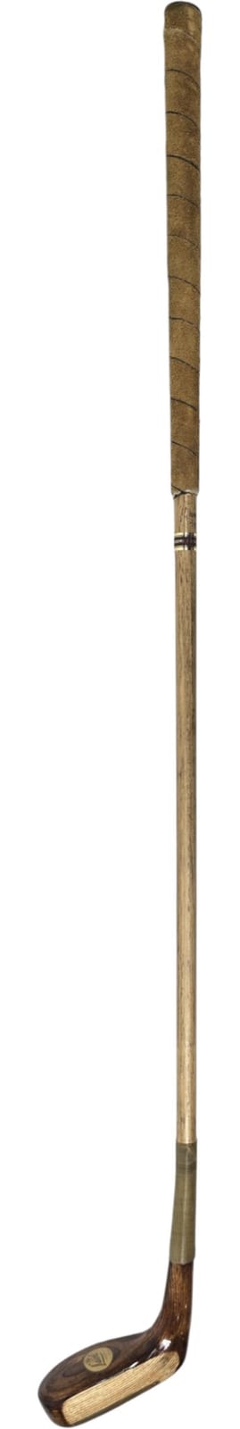 Vintage-looking golf club with a wooden club head and long shaft, photographed against a white background.
