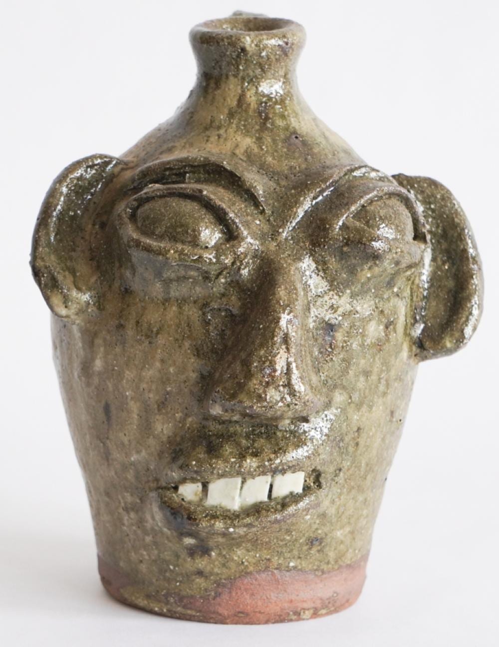 Burlon Craig comparable auction result: fine southern stoneware north carolina face jug by burlon craig