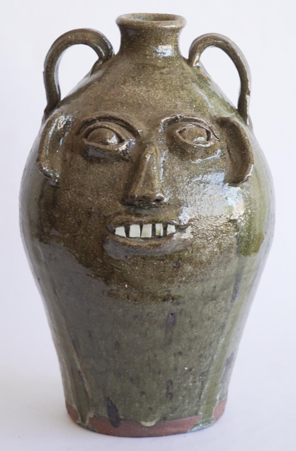 Burlon Craig comparable auction result: excellent north carolina southern stoneware face jug by burlon craig