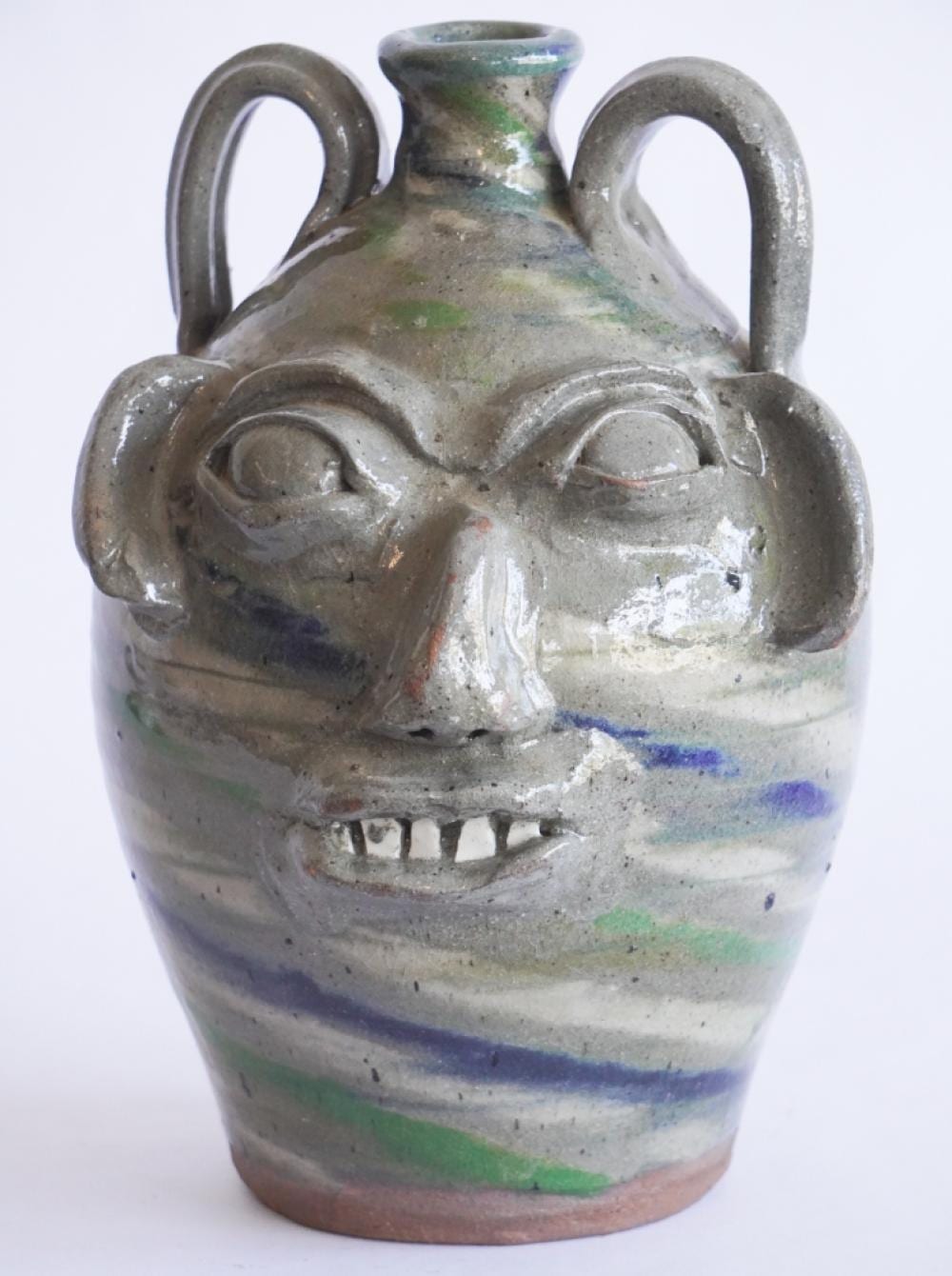 Burlon Craig comparable auction result: excellent uncommon north carolina stoneware swirl face jug by burlon craig