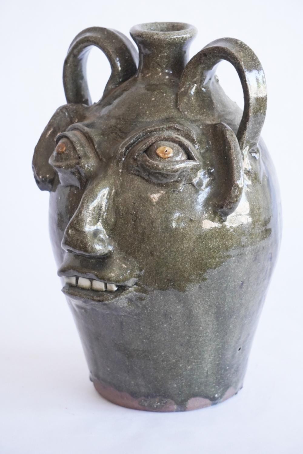 Burlon Craig comparable auction result: handsome north carolina stoneware face jug by burlon craig