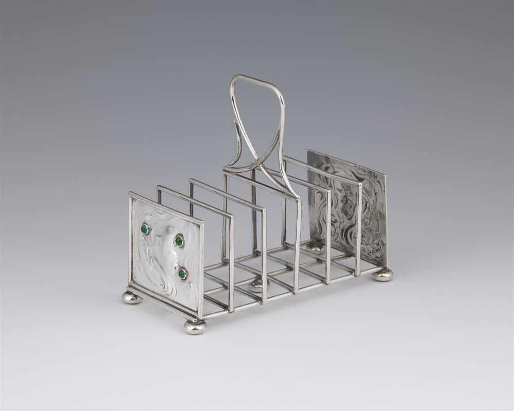 C. R. Ashbee comparable auction result: an arts and crafts silver toast rack by charles robert ashbee