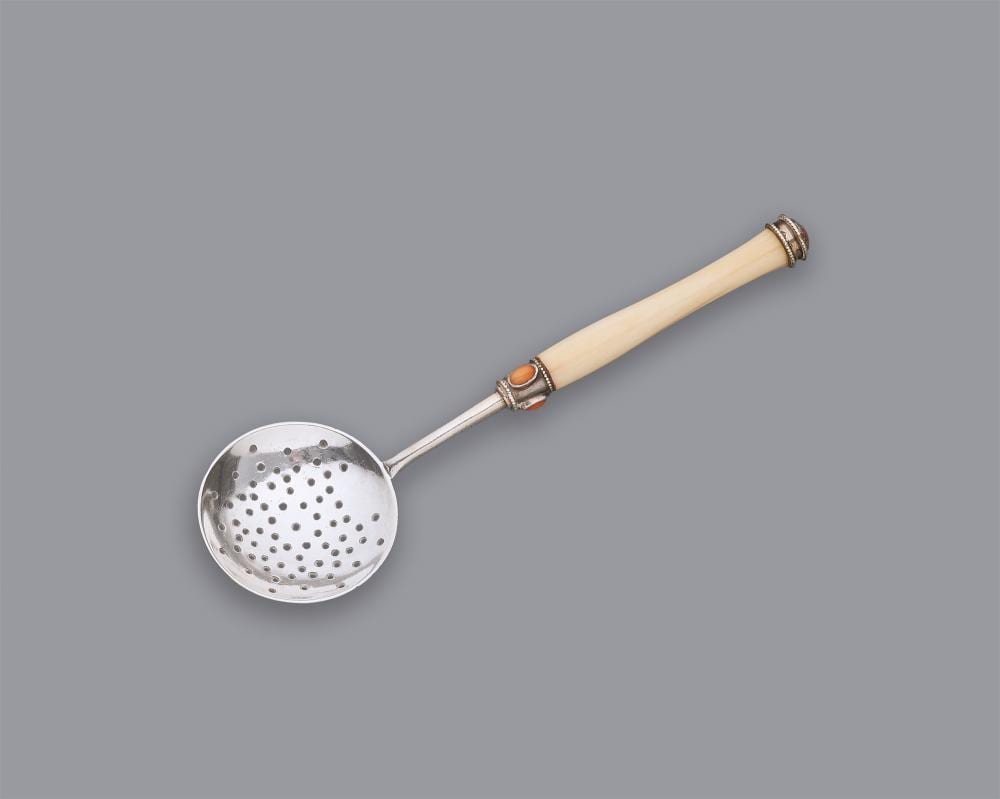C. R. Ashbee comparable auction result: an arts and crafts silver and ivory sifter spoon by charles robert ashbee