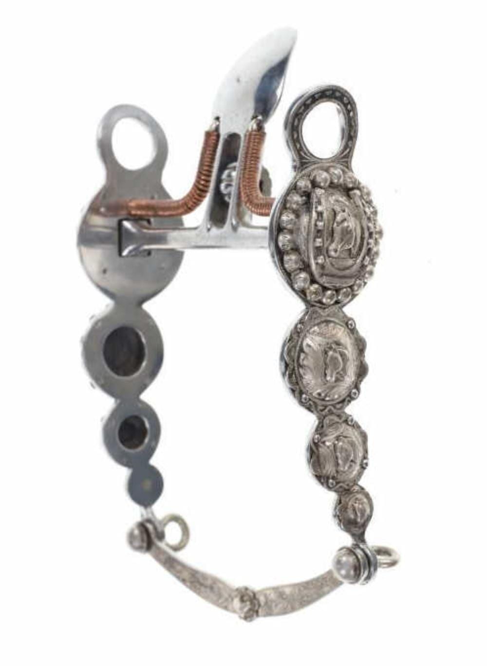 Vintage horse bit with a silver-colored frame and detailed metal mouthpiece, shown against a white background.
