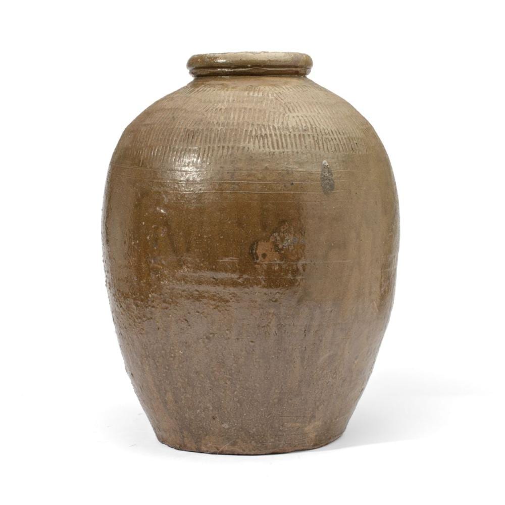 Brown ceramic jar with a rounded belly, short neck, and simple rim, shown against a white background.