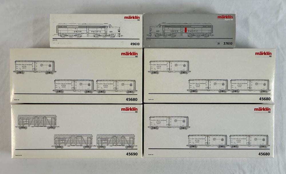 Six Märklin HO scale model train freight cars and locomotives shown on product packaging with visible box art and part numbers.