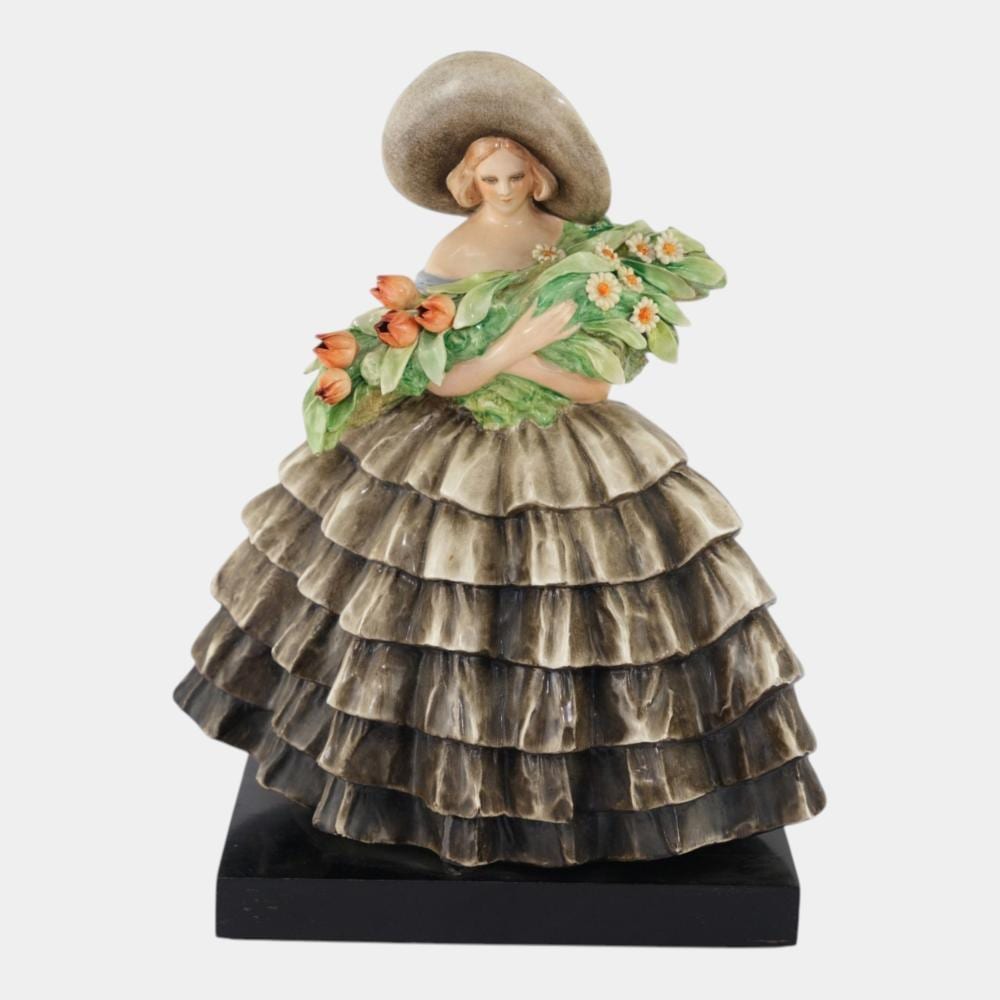 Guido Cacciapuoti comparable auction result: guido cacciapuoti italian 1892 1953 1930s porcelain 12 tall woman with bouquet figurine on wooden base