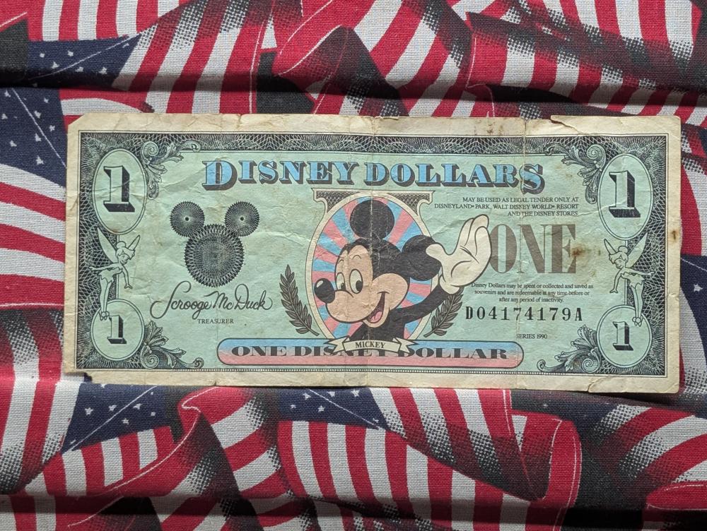 Series 1990 Disney Dollars One Dollar Banknote, Mickey Mouse sold by Richard L. Edwards Auctioneer, lot 363K — auction record photograph